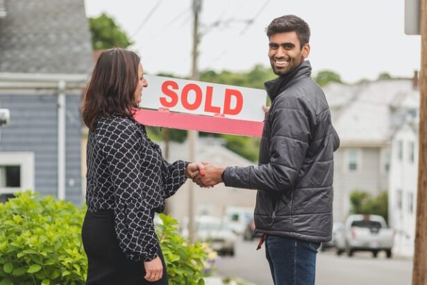 Man shaking hands with his Realtor® after buying rental property in Seattle